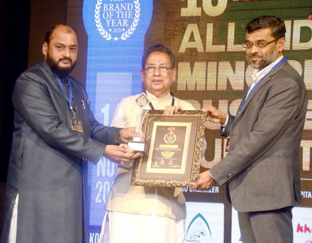 M Nurul Islam receiving the award from the hands of M. Aslam Khan, founder Chairman, Octaware Technologies Limited along with Danish Reyaz of Maeeshat Media. Photo: Maeeshat