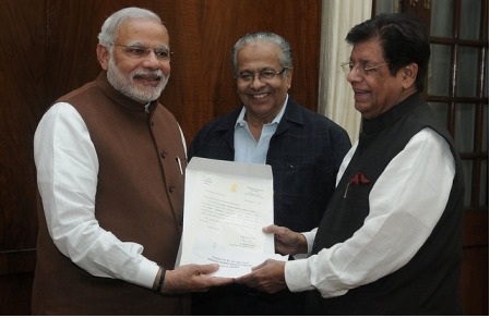 E. Ahamed, MP and national president, Indian Union Muslim League (IUML) handing over a cheque of Rs 25 lakh to Prime Minister Narendra Modi for PMNRF