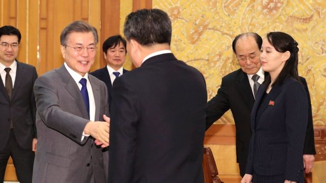 South Korean President Moon Jae-in, left, shakes hands with Ri Son Gwon, chairman of the North Korea's agency that deals with inter-Korean affairs, as Kim Yo Jong, right, sister of North Korean leader Kim Jong-un, and Kim Yong Nam, North Korea's nominal head of state, stand during a meeting at the presidential house in Seoul on Saturday.