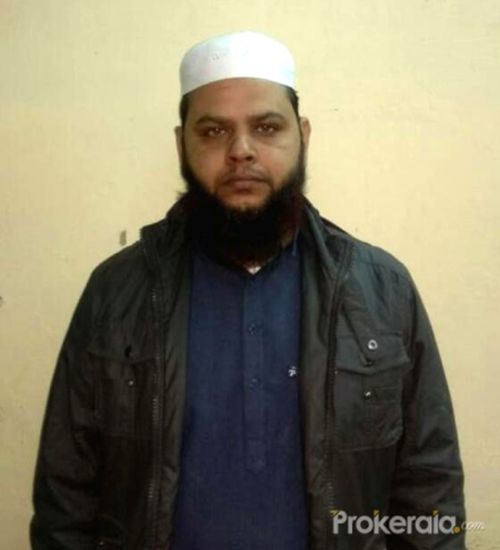 Muslim cleric Imran with bullet held at Delhi CM's Janta Darbar