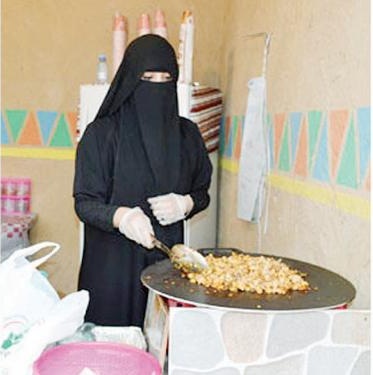 Nada Muhammad preparing food at her home. — Courtesy photo