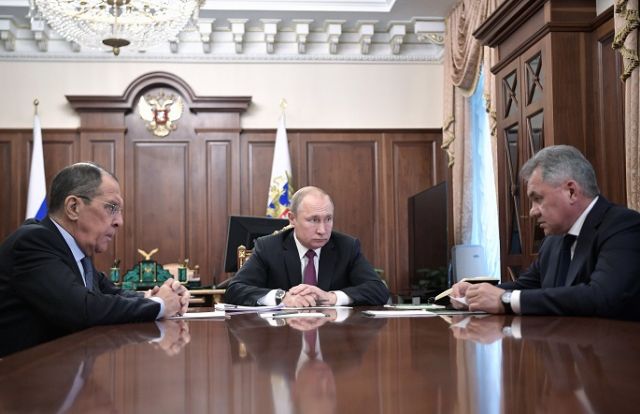 Vladimir Putin (center)