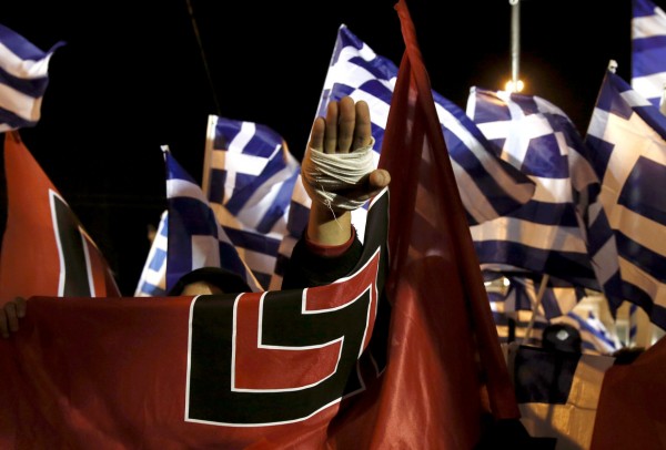 A supporter of Greece's far-right Golden Dawn party salutes in a Nazi style during a rally at central Syntagma square in Athens