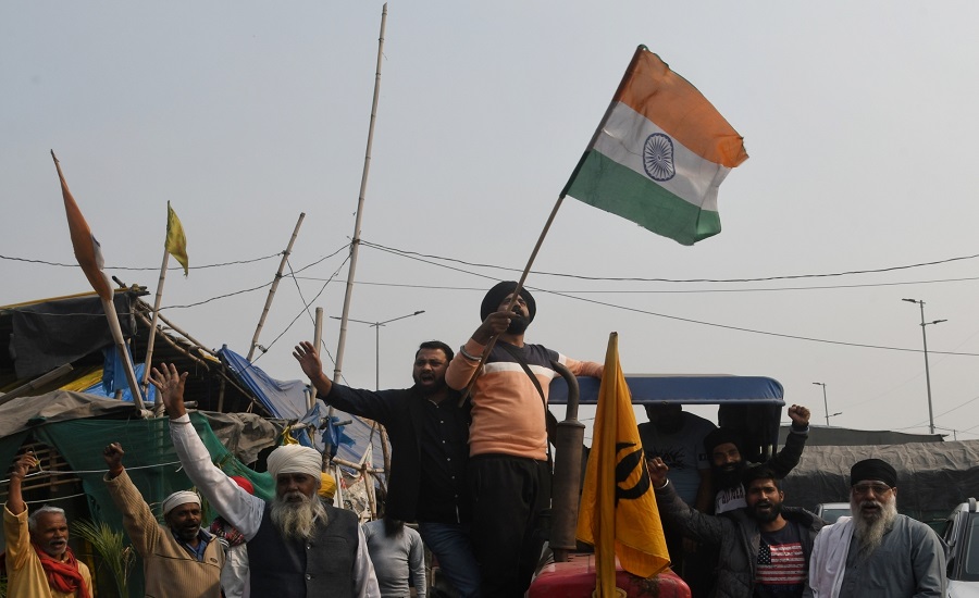 New Delhi : Farmers celebrating after Prime Minister Narendra Modi decided to repeal all three farm laws Gazipur border in New Delhi Friday, November 19, 2021. (Photo: Wasim Sarvar/ IANS)