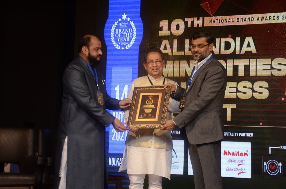M Nurul Islam receiving the award from the hands of M. Aslam Khan, founder Chairman, Octaware Technologies Limited along with Danish Reyaz of Maeeshat Media. Photo: Maeeshat